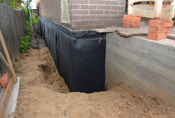 SJ Waterproofing Pros technician performing targeted Basement Waterproofing assessment in Williamsburg, IN